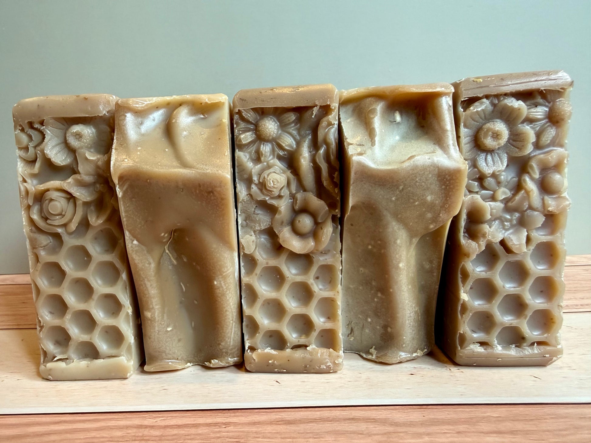 5 bars of oatmeal soap in a row alternating between tops & bottoms. 