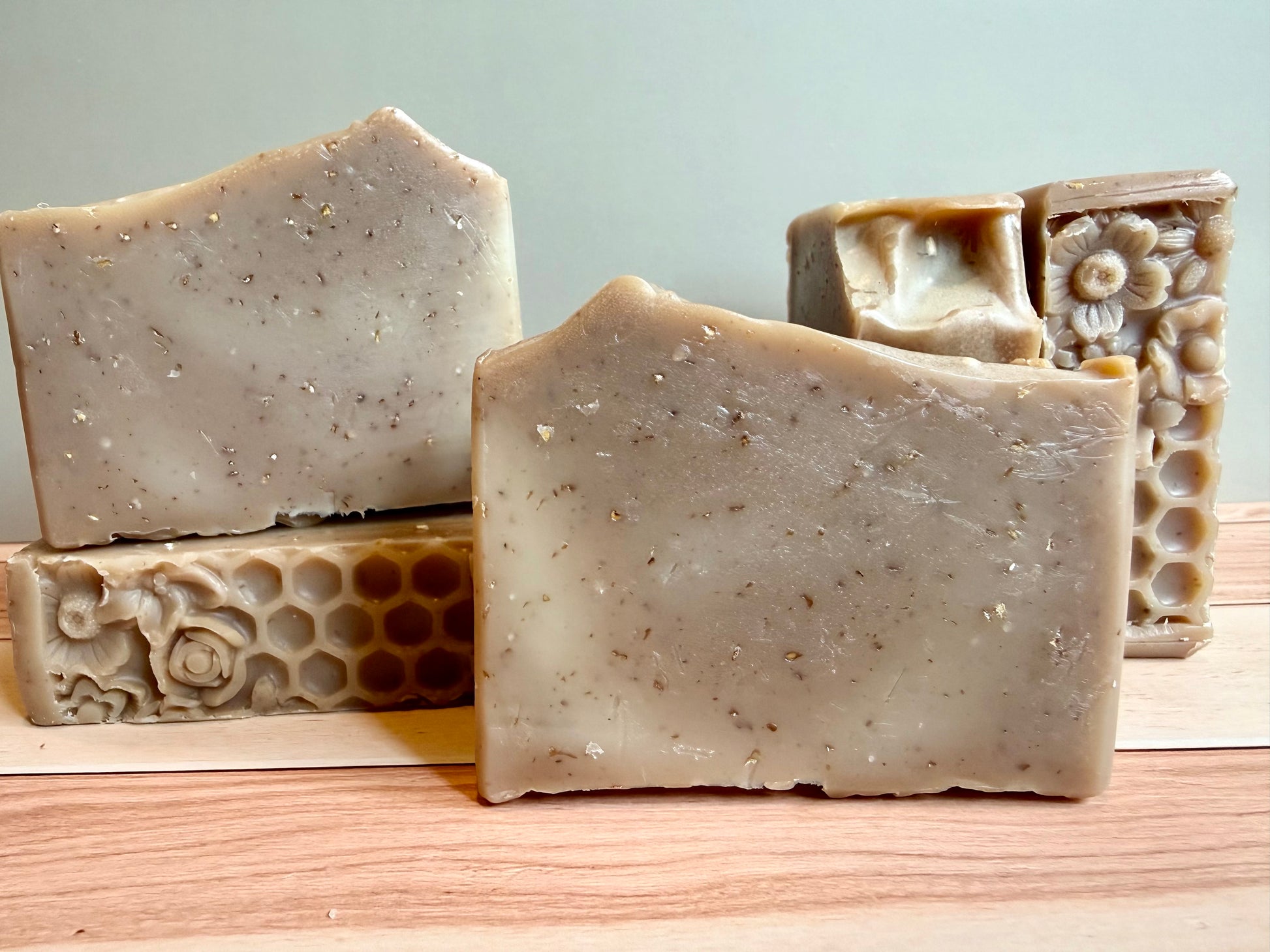 5 bars of oatmeal soap with floral & honeycomb bottoms, and mounded tops. 